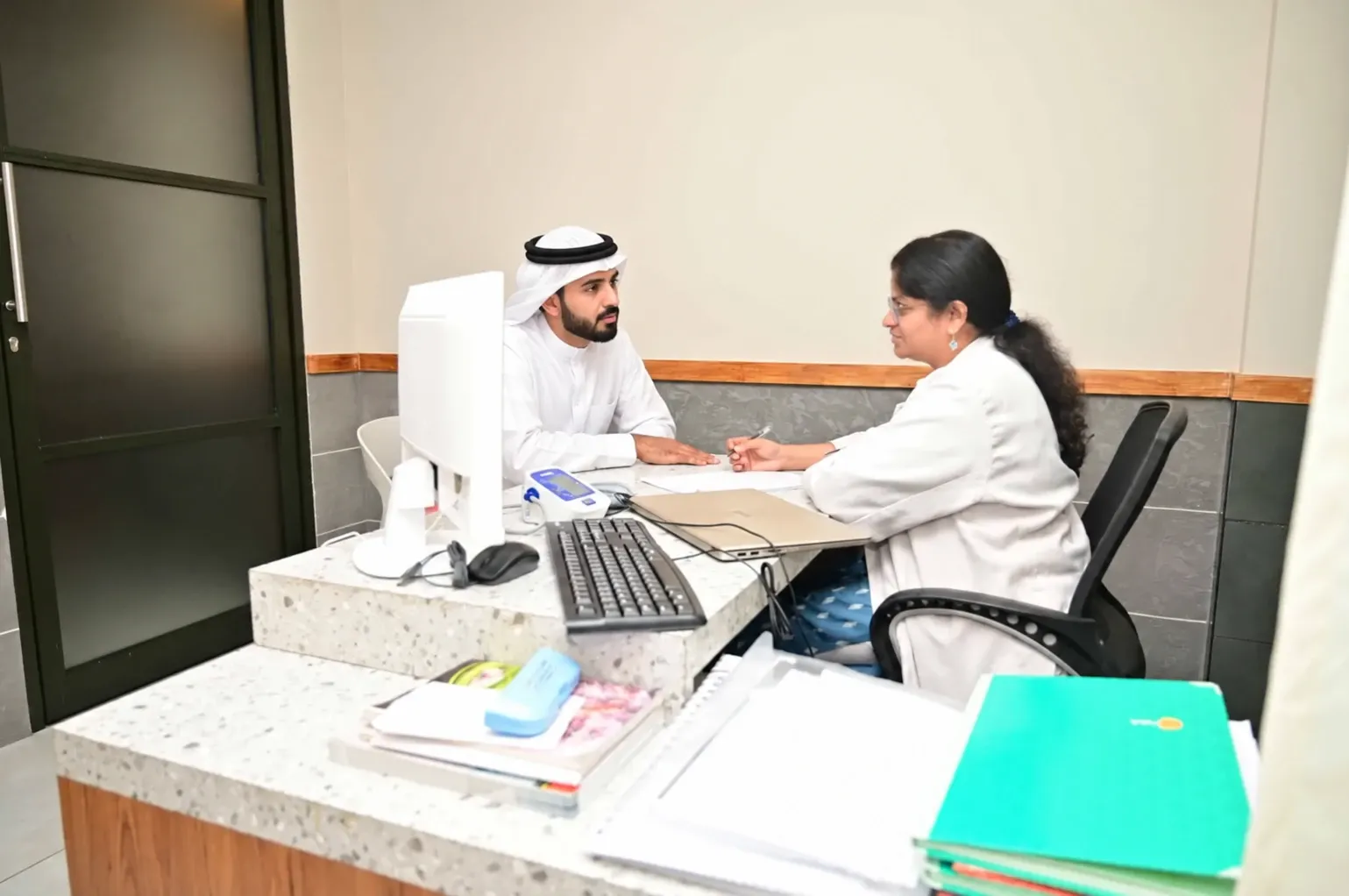 Doctor consulting a patient from the Gulf at Ayursiha Hospital